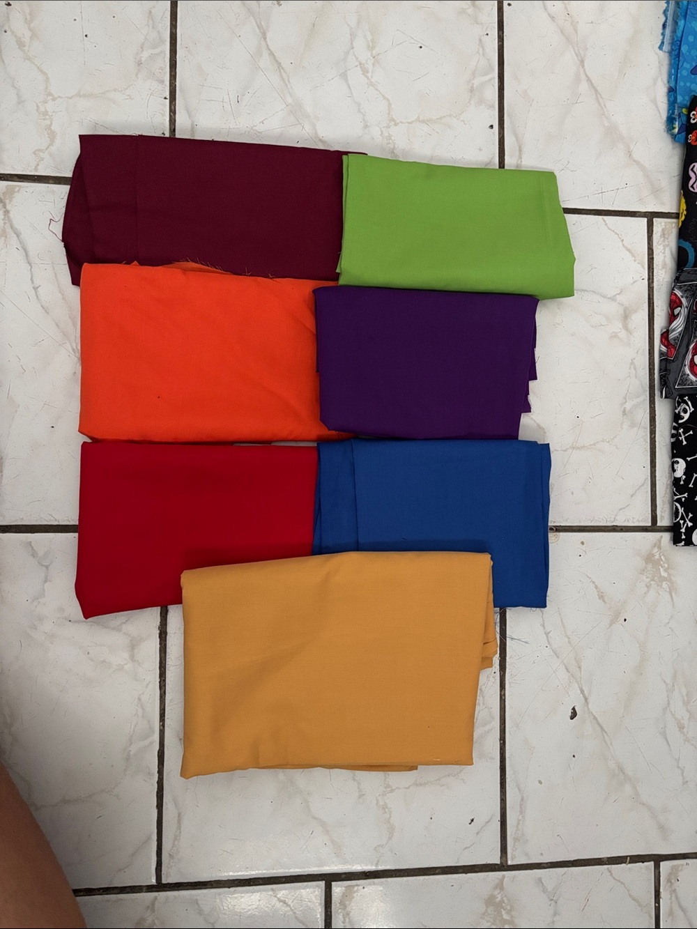 Solid colors pieces of cotton fabric with different sizes